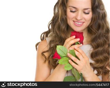 Portrait of young woman with red rose
