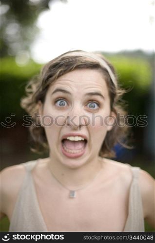 Portrait of Young Woman with Surprised Look
