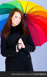 Portrait of young woman with umbrella