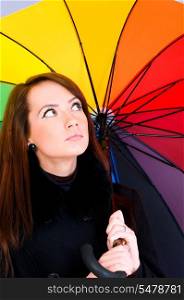 Portrait of young woman with umbrella