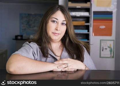 Portrait of young woman working in copy center