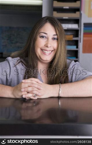 Portrait of young woman working in copy center
