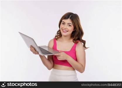 Portrait of young woman working on laptop computer isolated over white background. Business, people and technology concept.