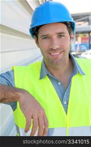 Portrait of young worker with security helmet