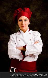 portrait photo of young female chef in front of rural background