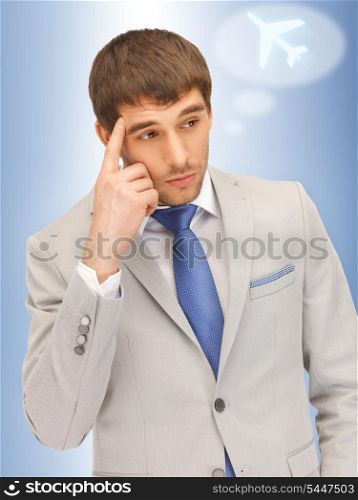portrait picture of pensive man with plane symbol