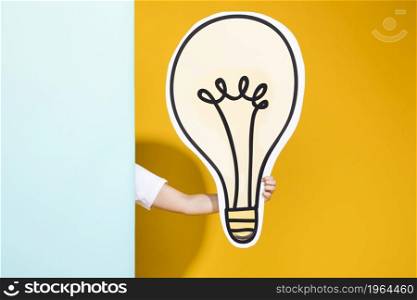 portrait schoolgirl with big light bulb. High resolution photo. portrait schoolgirl with big light bulb. High quality photo