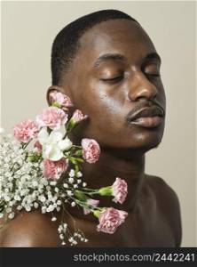 portrait shirtless man posing with bouquet flowers