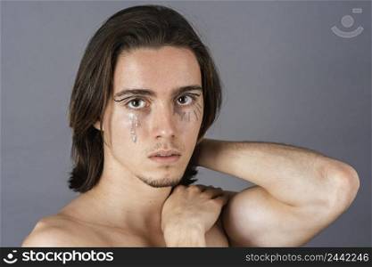 portrait shirtless man with make up