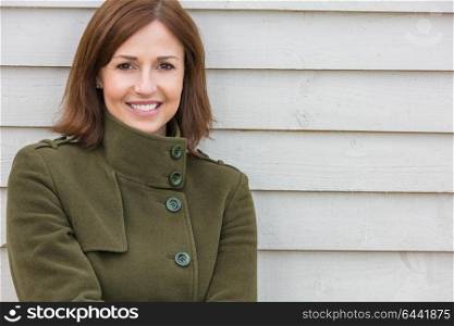 Portrait shot of an attractive, successful and happy middle aged woman female outside smiling