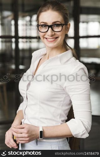 portrait smiley businesswoman indoors