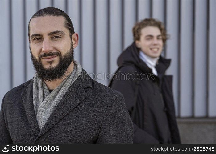 portrait smiley men posing outdoors