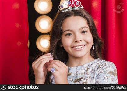 portrait smiling cute girl wearing crown