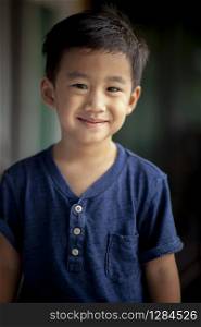 portrait smiling face of asian children standing with relaxing emotion