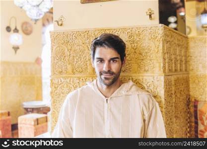 portrait smiling muslim man restaurant