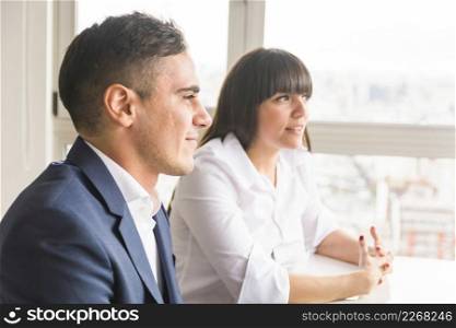 portrait smiling young business couple office