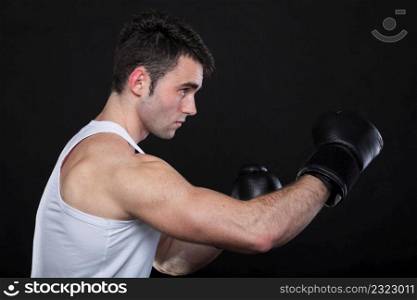 Portrait sportsman boxer in studio against dark background