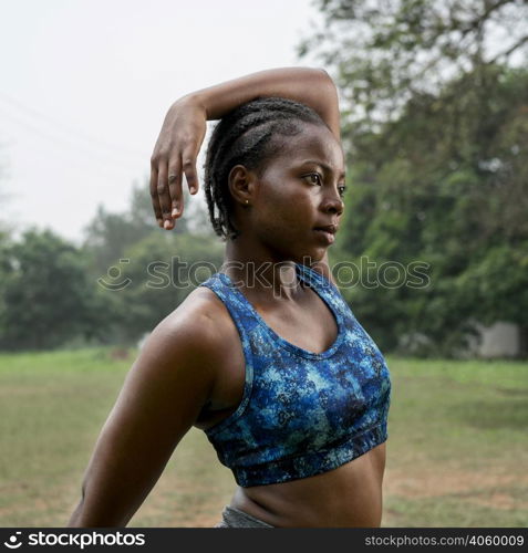 portrait sporty woman nature stretching