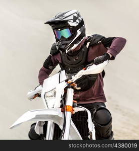 portrait stylish motorcycle rider with helmet