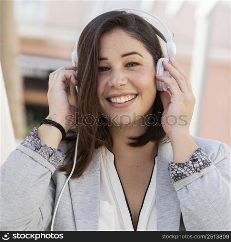 portrait teenager posing with her headphones