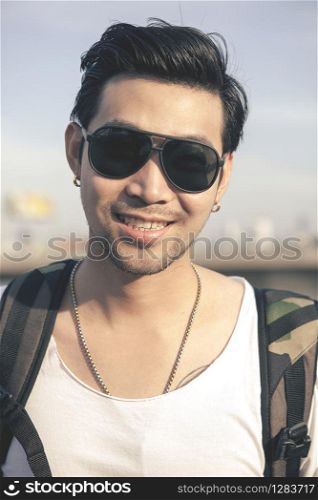 portrait toothy smiling face of asian younger man