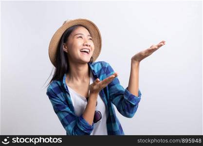 Portrait, tourist Beautiful of Asian woman Present and smiling isolated on white background, Asia girl wear Plaid shirt and wear Straw hat, Sunglasses, copy space, Summer concept