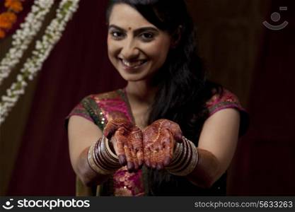 Portrait up of bride&rsquo;s hand with henna tattoo