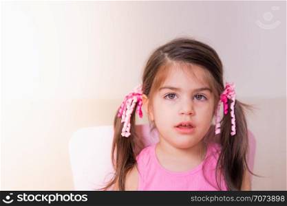 Portrait view of cute girl with confused expression on her face.isolated portrait.. Portrait view of cute girl with confused expression