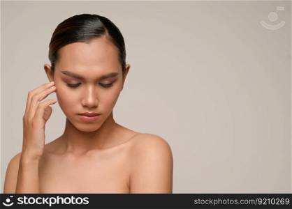 Portrait with manicure hands of beautiful asian woman touch cheek and closed her eyes, beautiful natural clean skin nature make up,  fresh spa female beauty cometic, copy space
