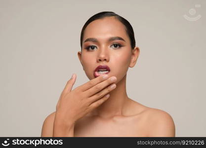 Portrait with manicure hands of beautiful asian woman use fin≥r touch on lips,  beautiful natural c≤an skin nature make up,  fresh spa fema≤beauty cometic,©space