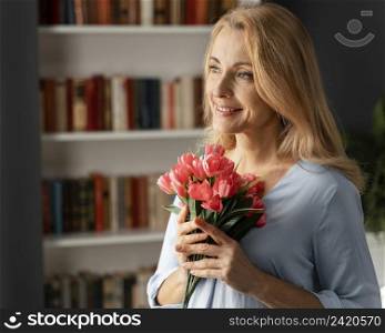 portrait woman counselor holding flowers bouquet
