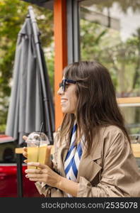 portrait woman drinking lemonade