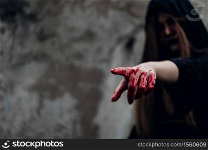 Portrait woman ghost devil demon costume horror and scary she has point finger out and hand have red blood, Happy Halloween day concept