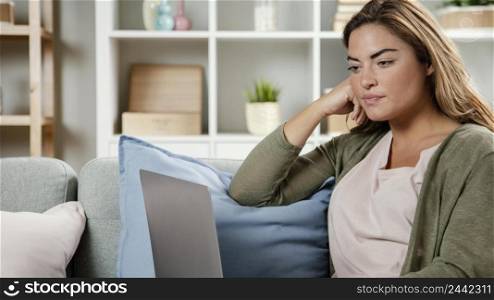 portrait woman home with laptop