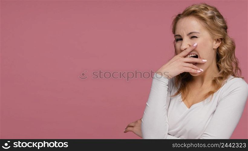 portrait woman laughing covers her mouth 2