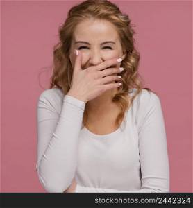 portrait woman laughing covers her mouth