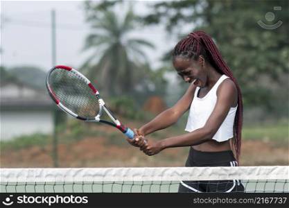 portrait woman playing tennis