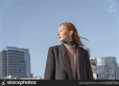 portrait woman posing outdoors against sky