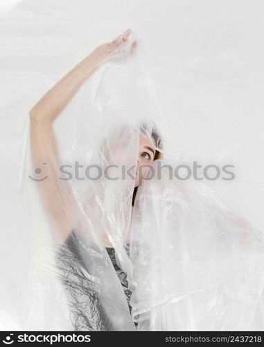 portrait woman posing with plastic foil 2