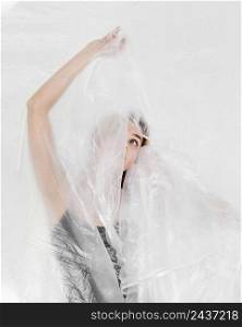 portrait woman posing with plastic foil 2