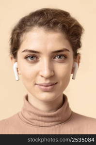 portrait woman using air pods