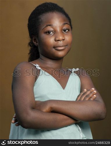 portrait young african girl with arms crossed 2