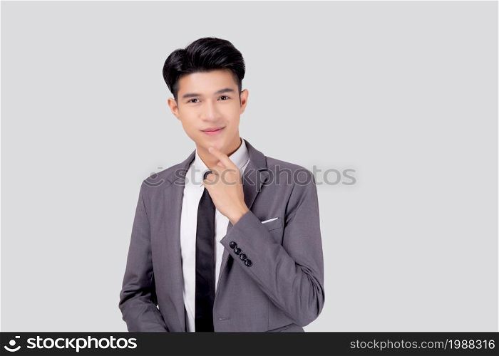 Portrait young asian business man in suit with smart thinking idea isolated on white background, businessman standing and planning for success, handsome manager or executive, emotion and expression.