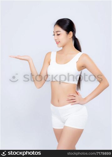 Portrait young asian woman smiling beautiful body diet with fit presenting something empty copy space on the hand isolated on white background, model girl weight slim with cellulite or calories, health and wellness concept.