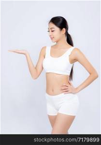 Portrait young asian woman smiling beautiful body diet with fit presenting something empty copy space on the hand isolated on white background, model girl weight slim with cellulite or calories, health and wellness concept.