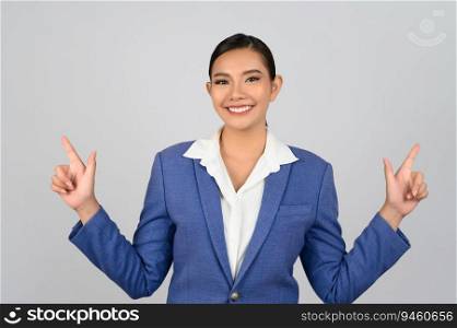 Portrait young beautiful woman in formal clothing for officer standing and point finger out with smile isolated on white background,  copy space for insert your advertisement