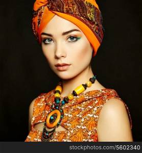 Portrait young beautiful woman with necklace. Fashion photo