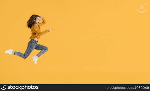 portrait young female jumping with copy space