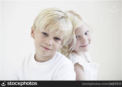 Portrait young girl and boy head to head