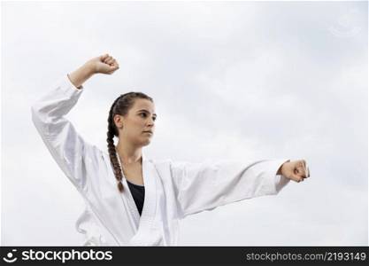 portrait young girl exercising karate